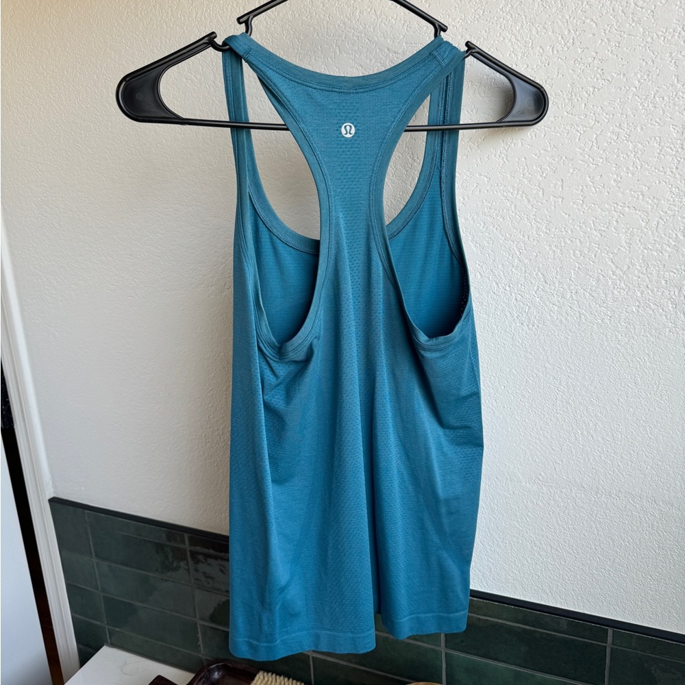 Lululemon Swiftly Tank. Never worn. Size 4. Hip length.